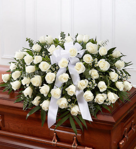 Rose Half Casket in White, half casket spray with white roses and mixed greenery accented with a white ribbon