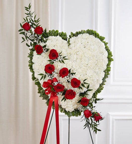 Always in My Heart Wreath, heart-shaped funeral standing wreath with white and red roses, greenery, and a red ribbon