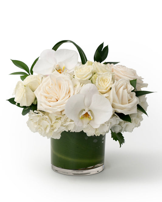 Flower arrangement of white Orchids and roses