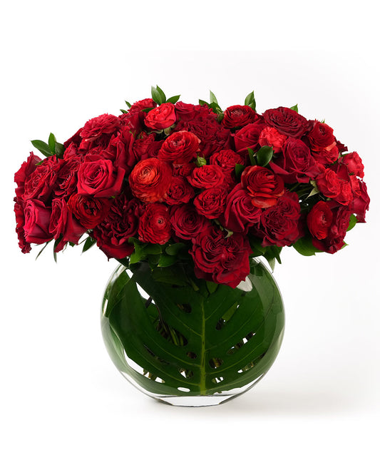  Product photo of The Grand Devotion floral arrangement with red roses in a large round glass vase