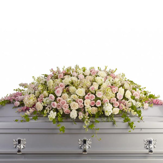 Always Adored Casket Spray, full casket spray with pink and white roses, white hydrangeas, and mixed pink flowers accented with ivy greenery