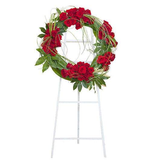 Royal Wreath, funeral standing wreath with red roses and lily grass greenery